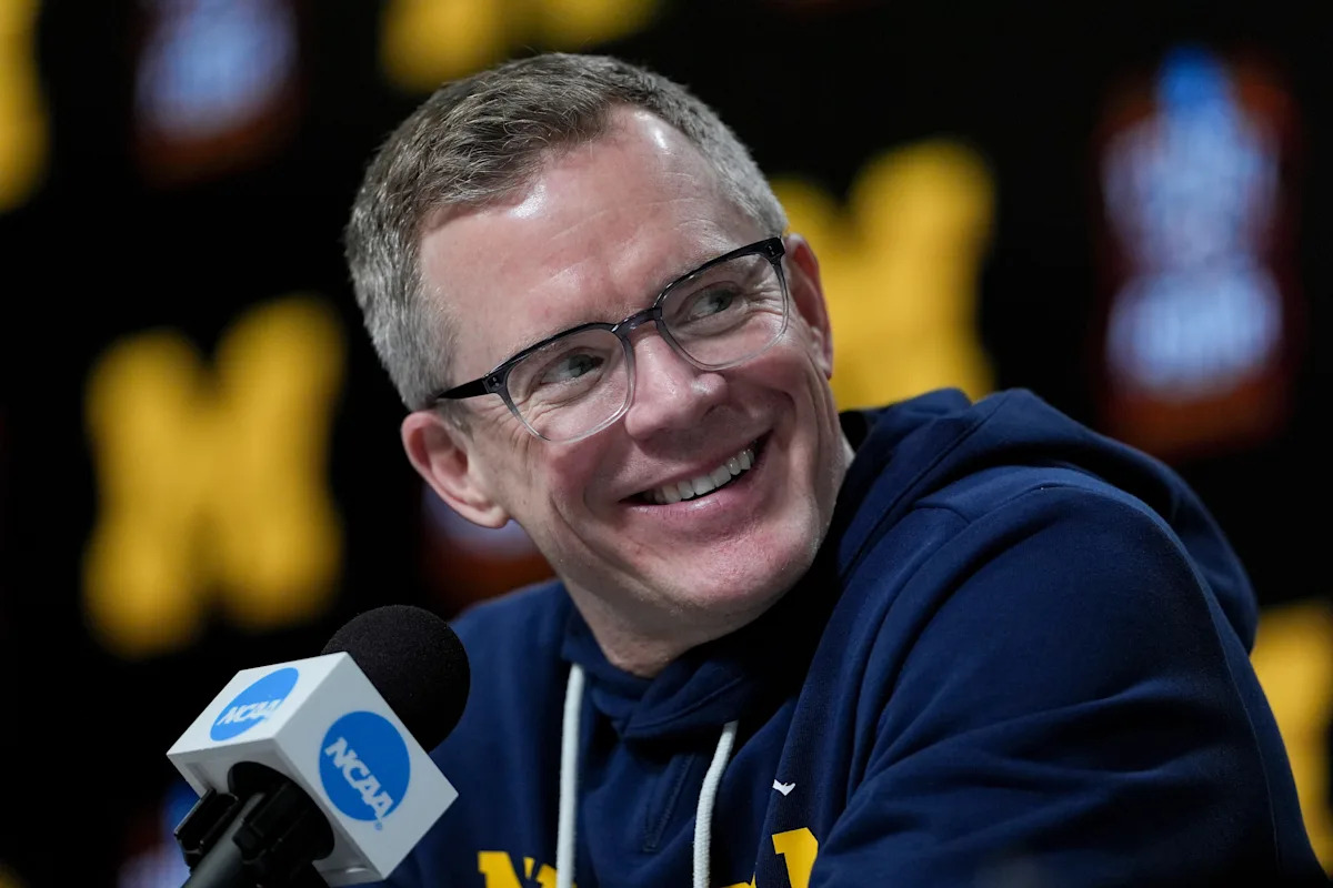 Michigan -- men's Hoops action coach Dusty May agree to contract extension observed today